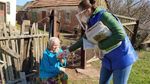 Elderly woman with headscarf receiving a Unilever product donation – part of Unilever’s work with the UN Refugee Agency