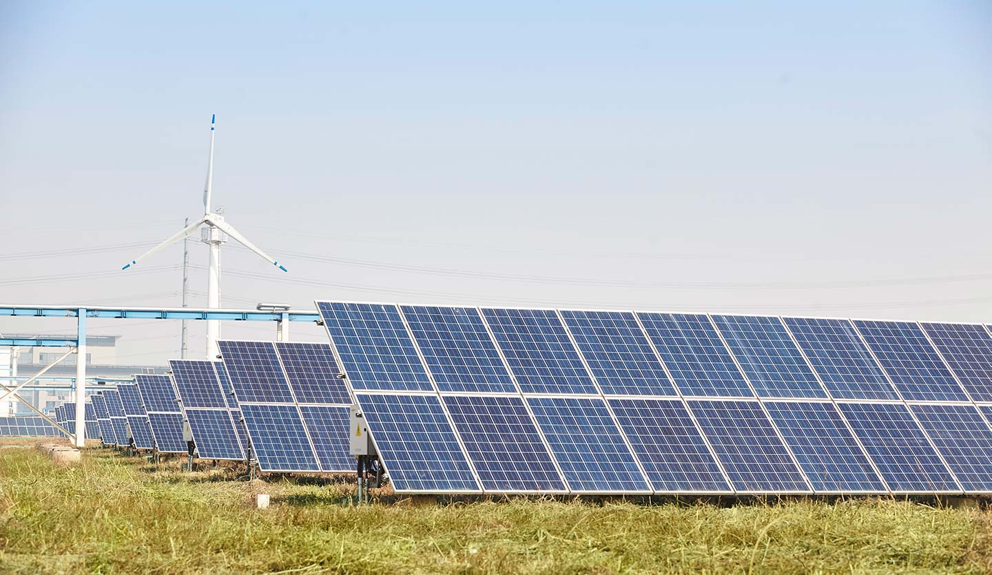 Solar panels and wind power, two key sources of green electricity used by Unilever