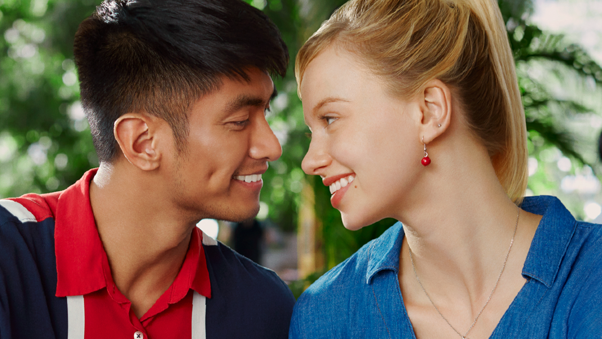 An Asian boy and American girl gaze into each other’s eyes and smile in an ad for Unilever’s Closeup toothpaste.