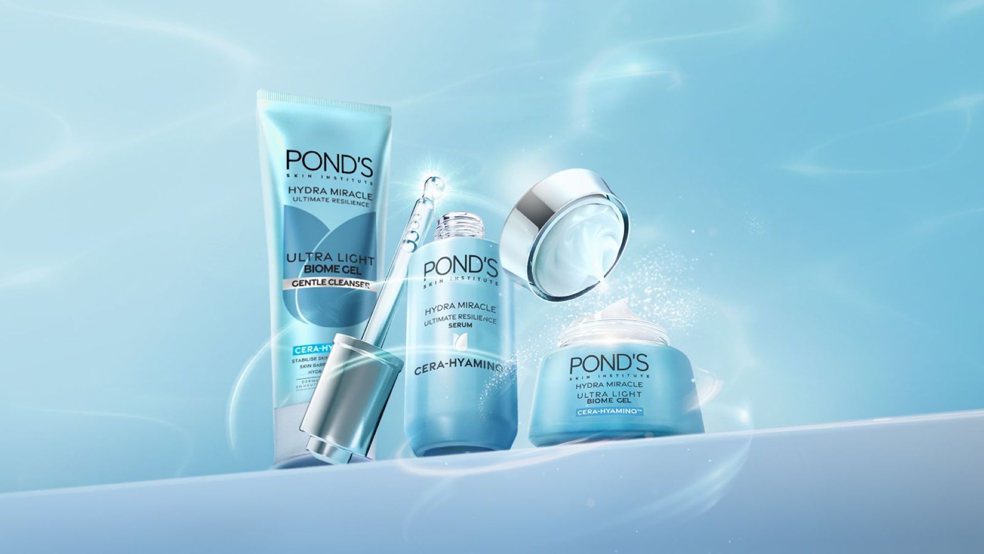 Three Pond’s Hydra Miracle Ultra Light products. Blue with silver accents. A bottle of serum is open, the pipette is visible.