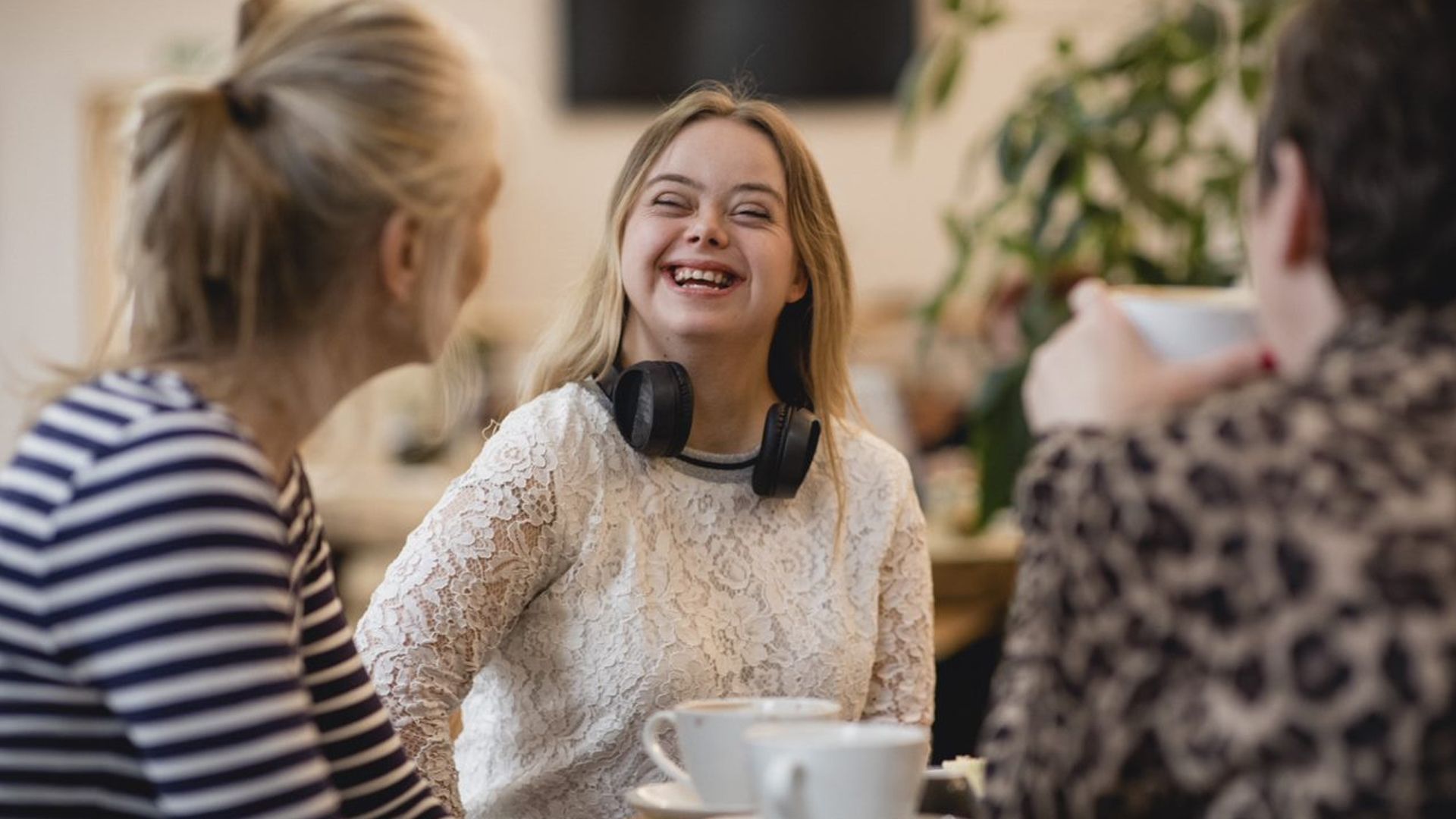 Girl in white top smiling