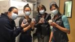 Four women holding out tubs of ice cream – part of Ben & Jerry’s Project Joy