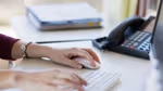 A person using a keyboard and mouse