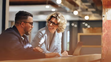 A man and a woman having a informal conversation