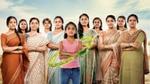 Eleven Indian women looking at the camera