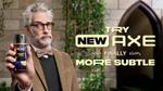 An ad for Axe Midnight Amber body spray reads ‘Try new Axe, finally more subtle’. A grey-haired professor holds an Axe can.