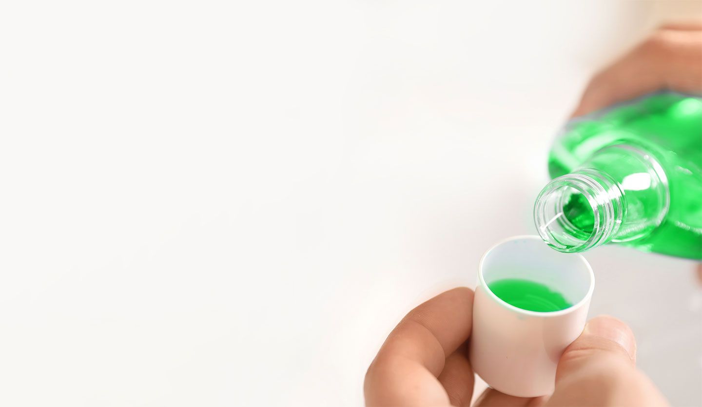 A photo of mouthwash in a glass