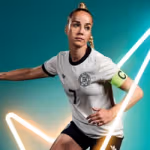 A football player wearing a white jersey with black trim and a green captain’s armband, posed in action with a ball at their feet. The background is teal with glowing white neon lines forming dynamic shapes.