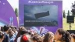 A crowd of people watching a screen showing Twister Cosmix ice lolly being launched into space