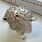 An EEG headset on a mannequin head. This technology is used in neurosignalling to track brain signals affected by sensory triggers.