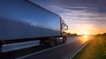 Truck transportation on the road at sunset