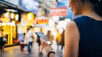 Woman on phone in Chinese market