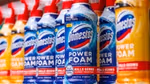A selection of Domestos Power Foam products on a supermarket shelf.