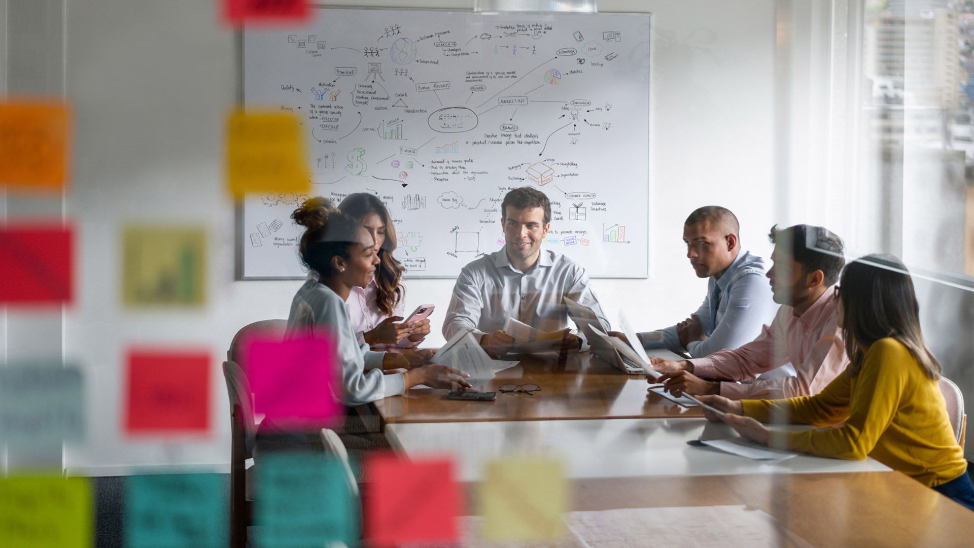 Six people in a boardroom