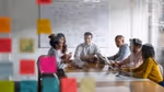 Six people in a boardroom