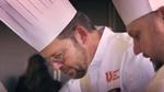A man wearing glasses, a chefs hat and chef whites featuring the Unilever Food Solutions logo