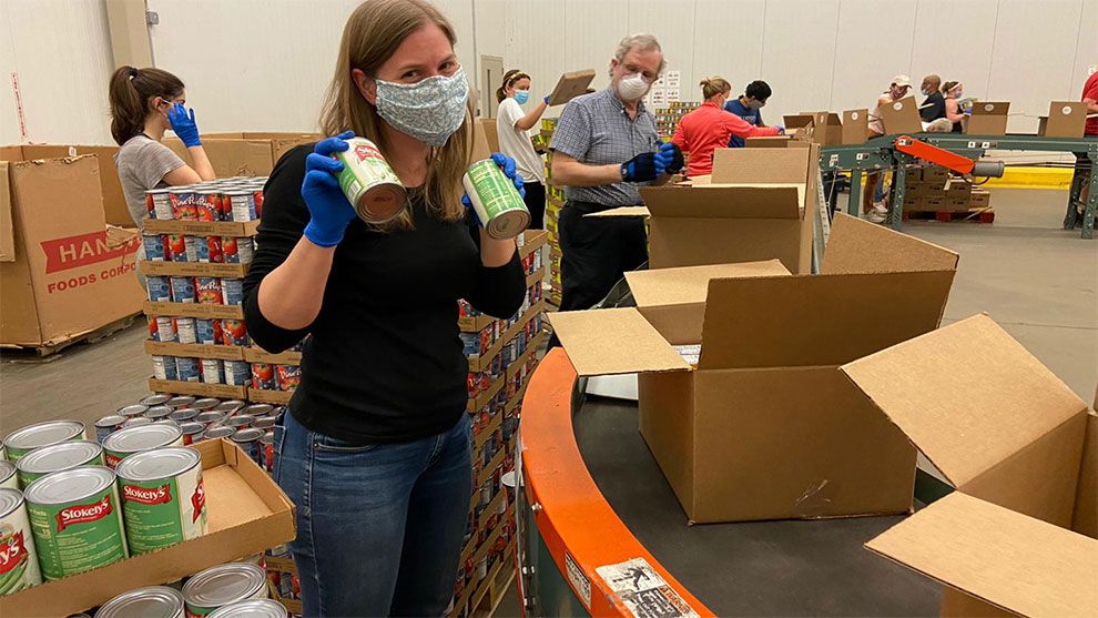 A photo of Unilever employees packing boxes for the United for America initiative