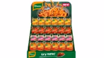 A display of Knorr Fast &  Flavourful cooking paste on a stand featuring jars of Chicken, Beef, and Vegetable Seasoning. The top of the stand shows pasta being seasoned with Knorr and a 'NEW' label. The bottom has a green background with the Knorr logo and 'try now!' next to a spoonful of seasoned food.