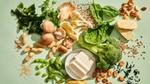 An assortment of vegetables, mushrooms, tofu, seaweed, tempeh, grains and nuts on a counter