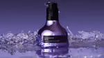 A bottle of Nexxus Keraphix Liquid Crystallizer. The bottle is a metallic silver-lilac colour with a black pump.