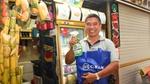 Man happily holding a cif spray bottle