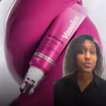 Promotional-style image featuring a magenta Vaseline Gluta‑Hya Lip Serum Gloss tube in the shade “Royal Plum.” The tube is shown large in the background against glossy, swirling magenta shapes. In the lower right corner, there is a small cut‑out image of a person with curly hair wearing a dark top, speaking toward the camera.
