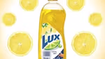 Bottle of Lux hand dishwashing liquid. The formulation is 99% biodegradable and uses 100% plant-derived ingredients.