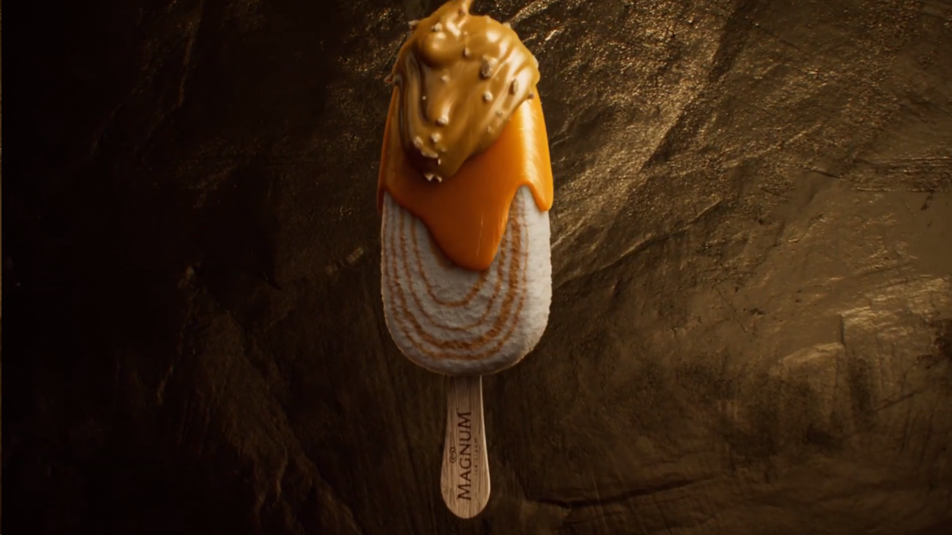 A Magnum ice cream against a brown rocky background.