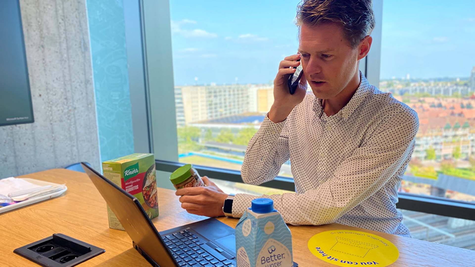 A man sitting at a computer inputting data