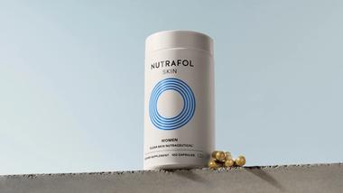 Bottle of Nutrafol Skin, a physician-formulated daily supplement for women designed to address the root causes of acne.