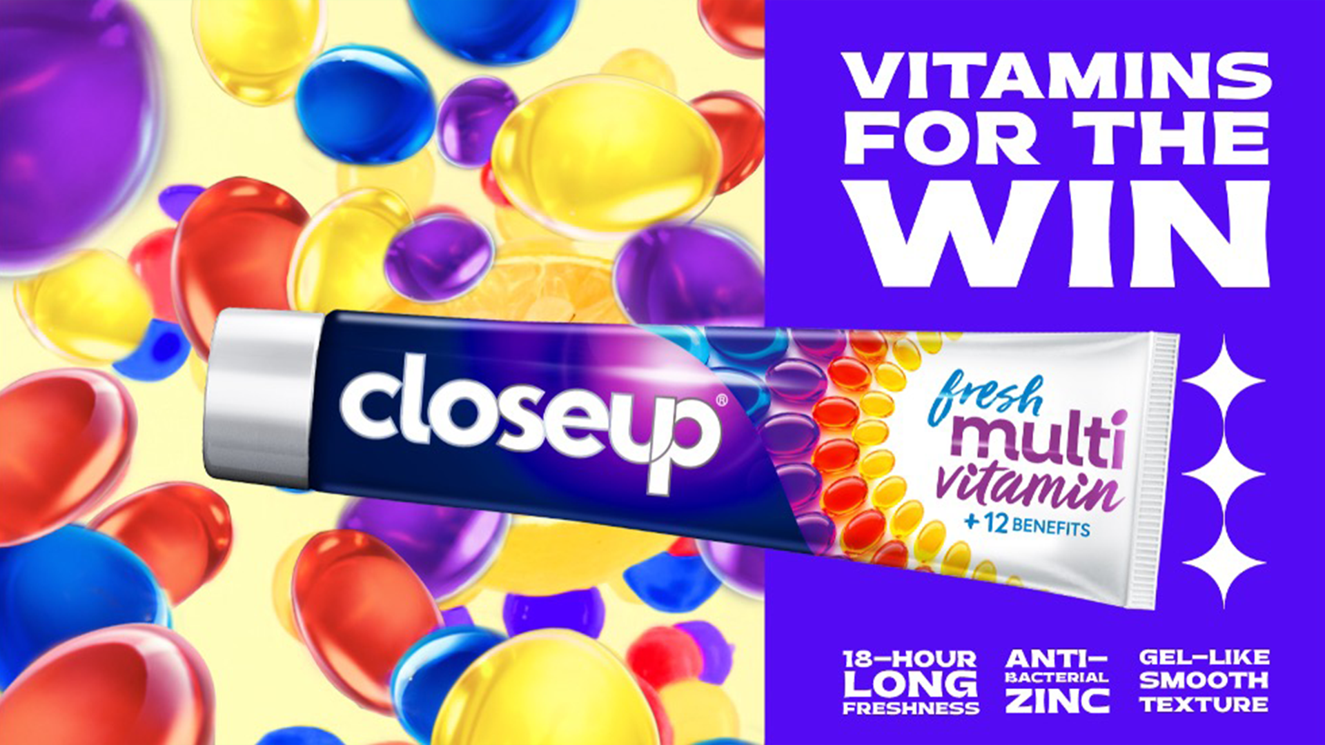A tube of Closeup Fresh Multi Vitamin toothpaste surrounded by colourful capsules. The text reads: “vitamins for the win”, highlighting benefits like 18-hour freshness, antibacterial zinc and gel-like texture.