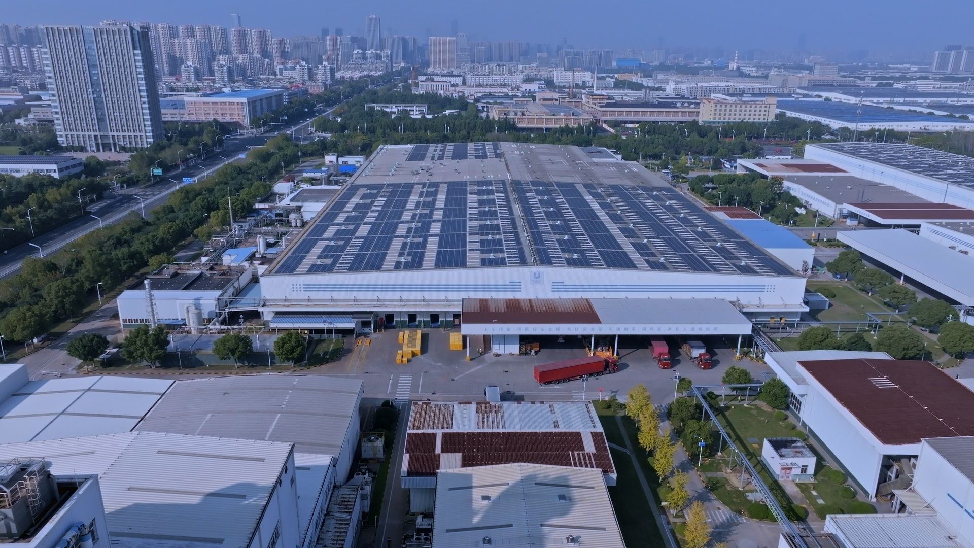 A shot of Unilever’s Heifei factory in China, equipped with solar panels on the roof. The city can be seen in the background.