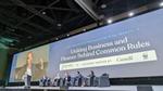 Five panellists seated on a stage under a large screen displaying the title 'Key priorities for an effective treaty: uniting business and finance behind common rules'. Unilever CEO Hein Schumacher is addressing the audience.