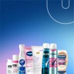 Unilever Q1 2026 results graphic featuring a lineup of Unilever products—including K18 haircare, Cif cleaning spray, Vaseline Gluta‑Hya lip care, Dove Whole Body Deo, Degree deodorants, and Hellmann’s Roasted Garlic Mayo—arranged along the bottom of a blue‑to‑purple gradient background with a curved Unilever ‘U’ design element.