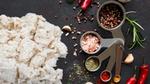 Fungi-based plant protein ABUNDA, developed by food tech firm ENOUGH, sitting on working surface with spices