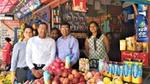 Group of people standing at a market stall for the launch of Horlicks in Nepal.