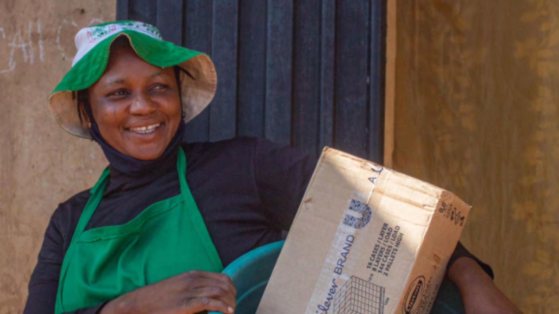 Woman with a basket of cleaning products that she resells as part of Unilever Nigeria’s Shakti project.