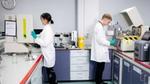 Two Unilever packaging material scientists testing samples to check their barrier properties against moisture, oxygen and light.
