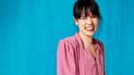 Woman in pink blouse laughing