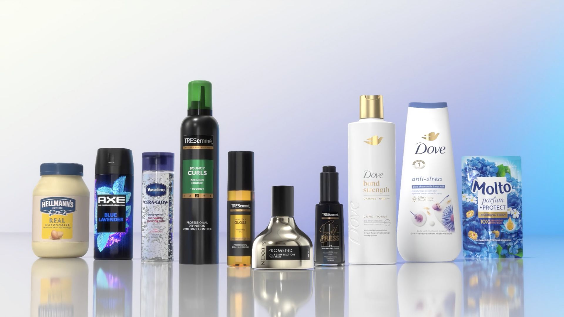 Lineup of various Unilever products including Hellmann’s mayonnaise, Axe body spray, Vaseline, TRESemmé hair care, Dove body wash, and Molto fabric conditioner displayed on a reflective surface.
