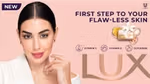 Promotional advertisement for Lux soap featuring Yasmine Sabri, a celebrity and the current face of LUX in Arabia. The image includes the tagline 'FIRST STEP TO YOUR FLAW-LESS SKIN', icons for Vitamin C, Vitamin E, and Glycerine, a Lux soap bar surrounded by flowers and ingredients, a 'NEW' label, and the Unilever logo."