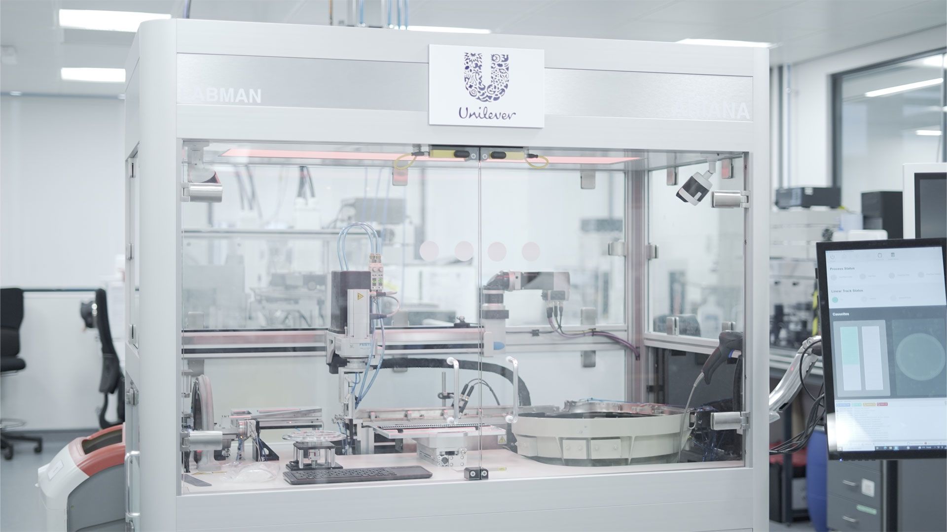 A beauty robot named Ariana prepares hair samples for Unilever product testing at the Materials Innovation Factory