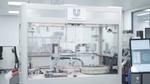 A beauty robot named Ariana prepares hair samples for Unilever product testing at the Materials Innovation Factory