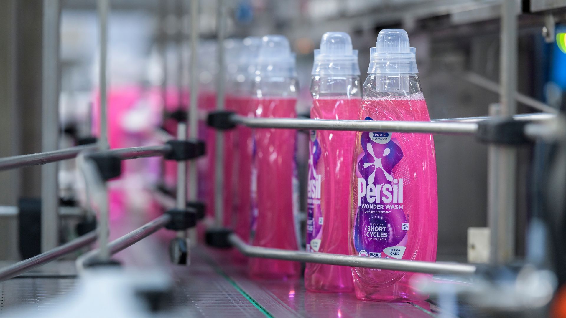 Bottles of Persil Wonder Wash on a Unilever factory production line