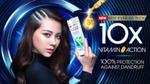 A woman holds a bottle of Clear anti- dandruff shampoo. The niacinamide shampoo helps to give 100% protection against dandruff