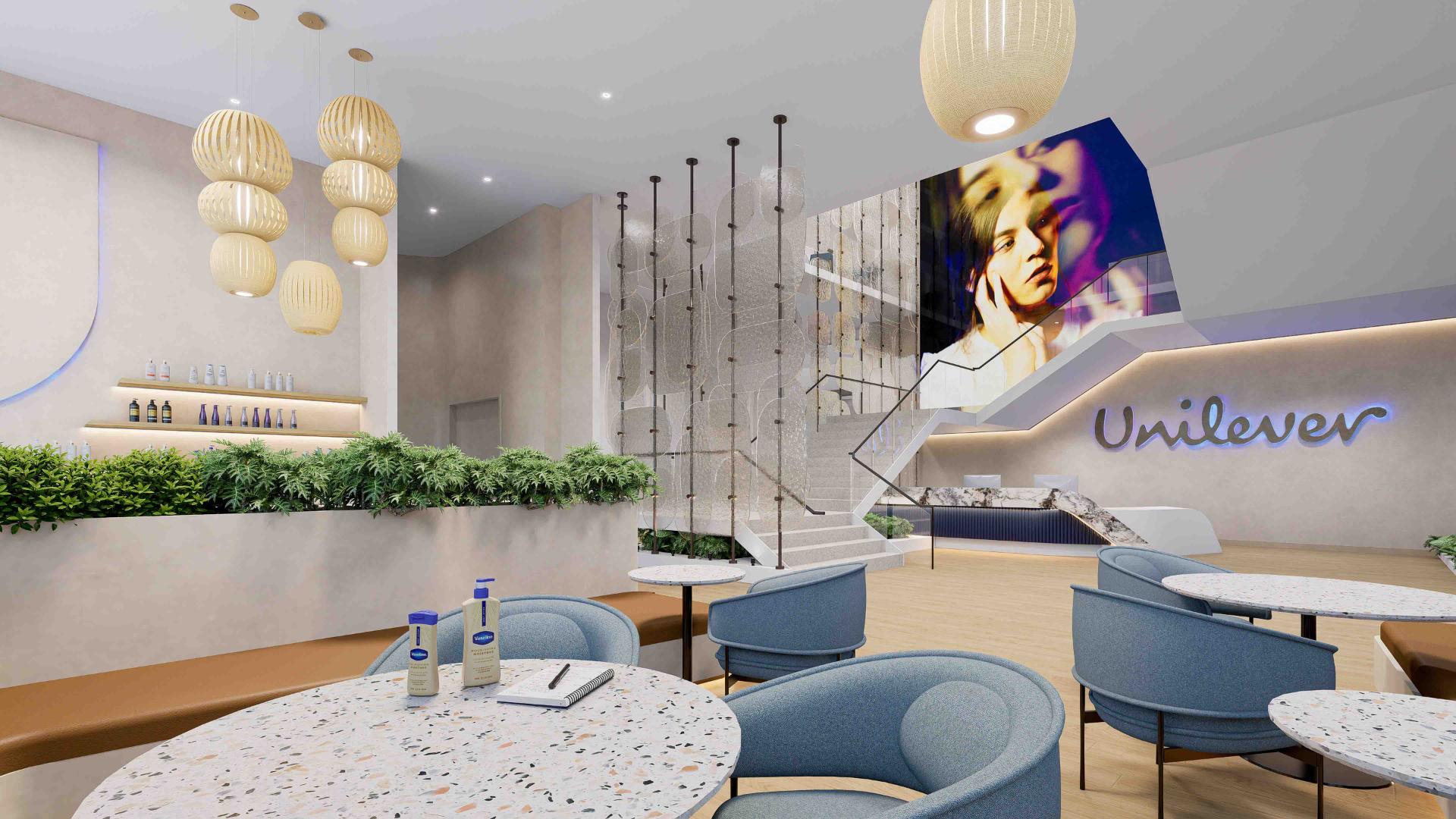 Rendering of lobby of Unilever’s new Global Innovation Center. Modern and warm looking entrance with greenery, fun lighting, and Unilever loco in blue lights.
