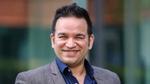 Aseem Puri, CEO of Unilever International, smiling at the camera; UI caters to underserved markets, channels and consumers.