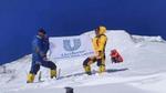 Volunteers during mountain clean-up, holding Unilever Nepal flag