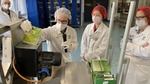 Jennifer Han looks at the machine which is offering food waste management solutions in Heilbronn