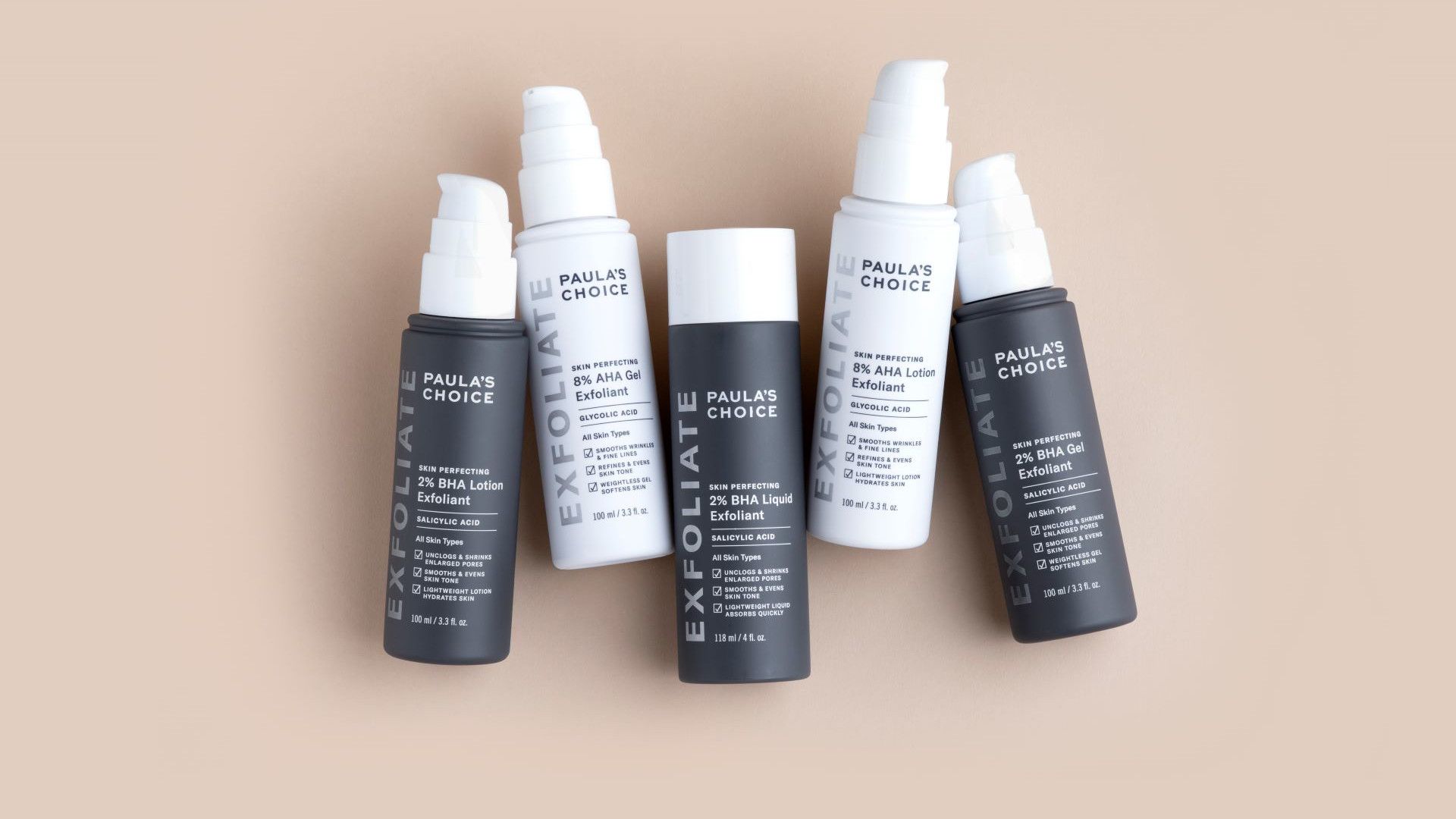 A photo of products from the Paula’s Choice AHA Exfoliant and BHA Exfoliant range. Packaging is white and dark grey.